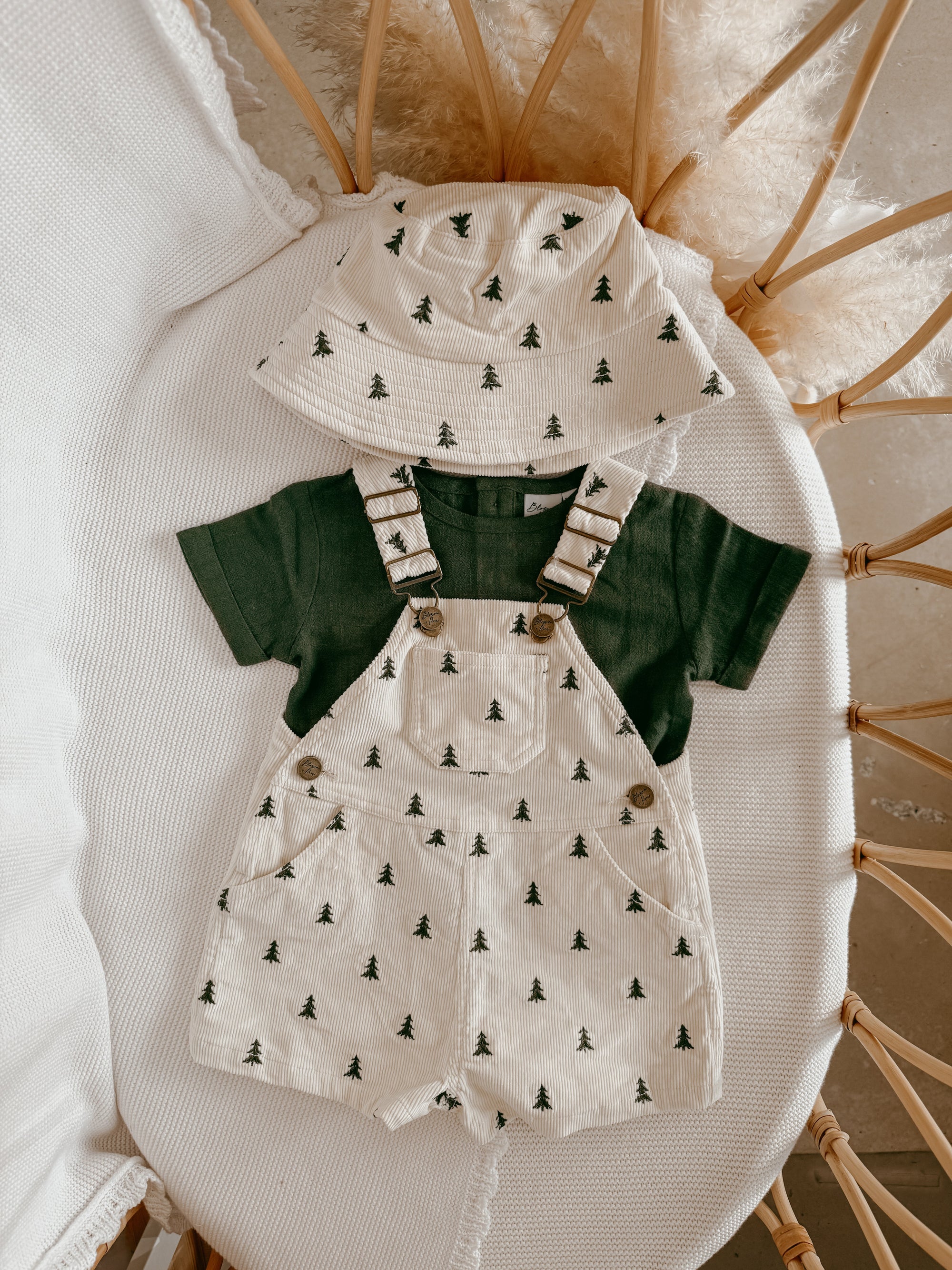 Christmas tree print corduroy kids overalls with a matching bucket hat and forest green tee