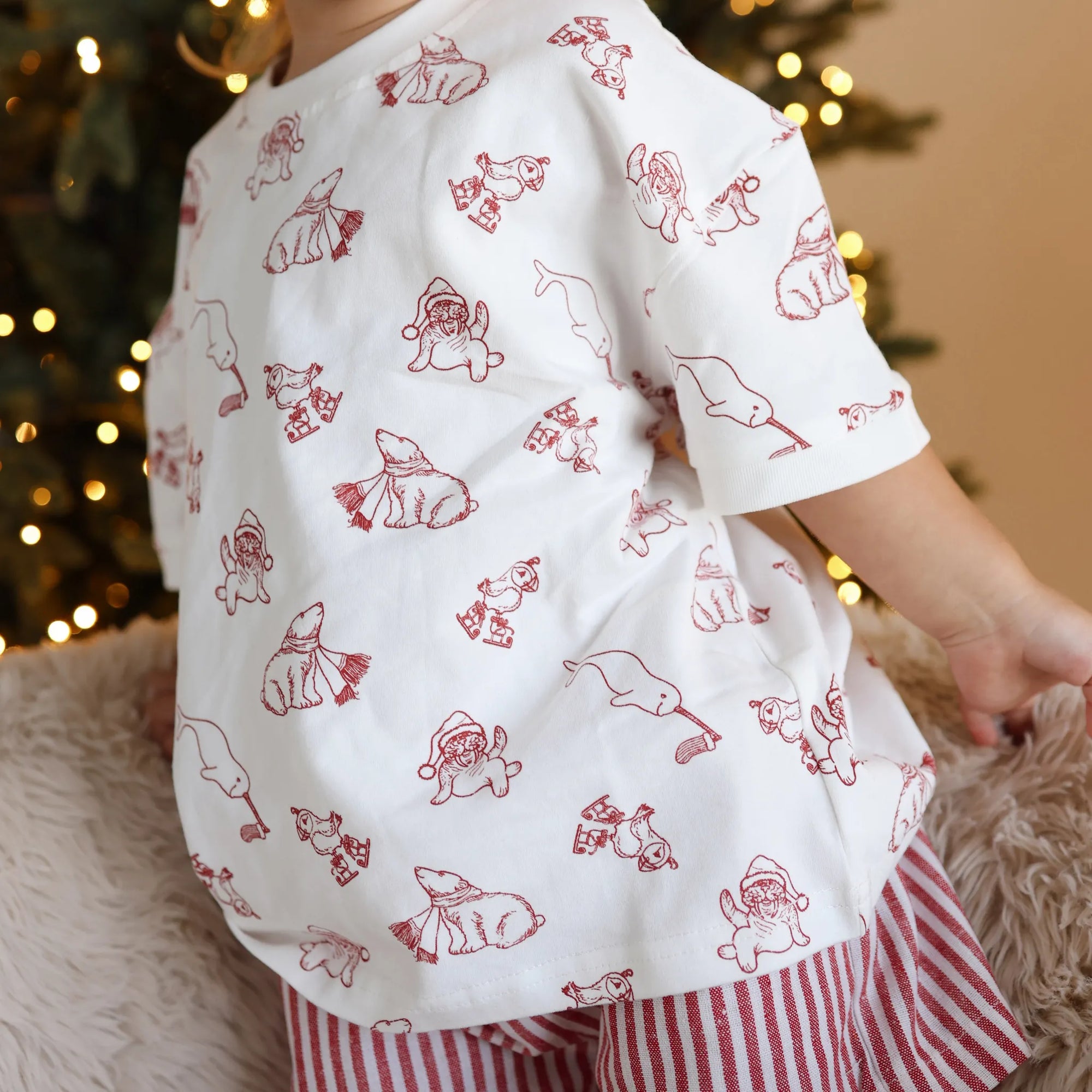 Back detail of a Christmas bear print shirt showing the red polar bear and Santa illustrations